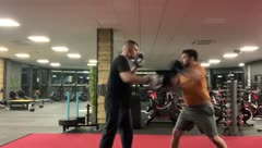 Gary Murray coaching pad work with a client